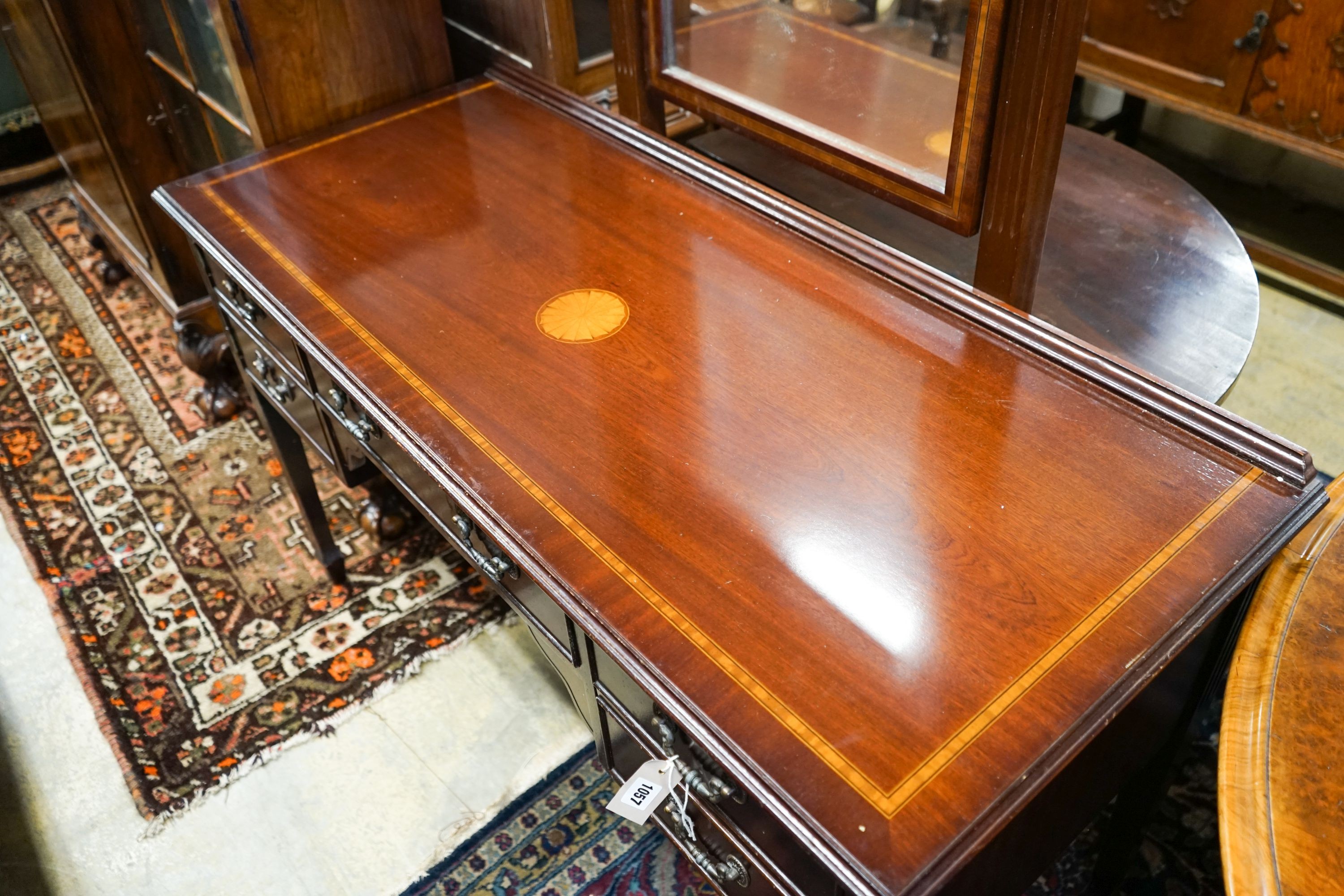 An Edwardian style inlaid mahogany dressing table with swing mirror, length 128cm, depth 54cm, height 158cm